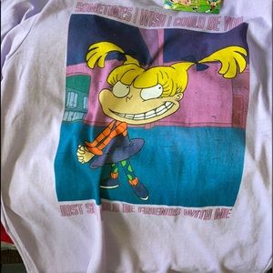 It’s a lavender Nickelodeon shirt.